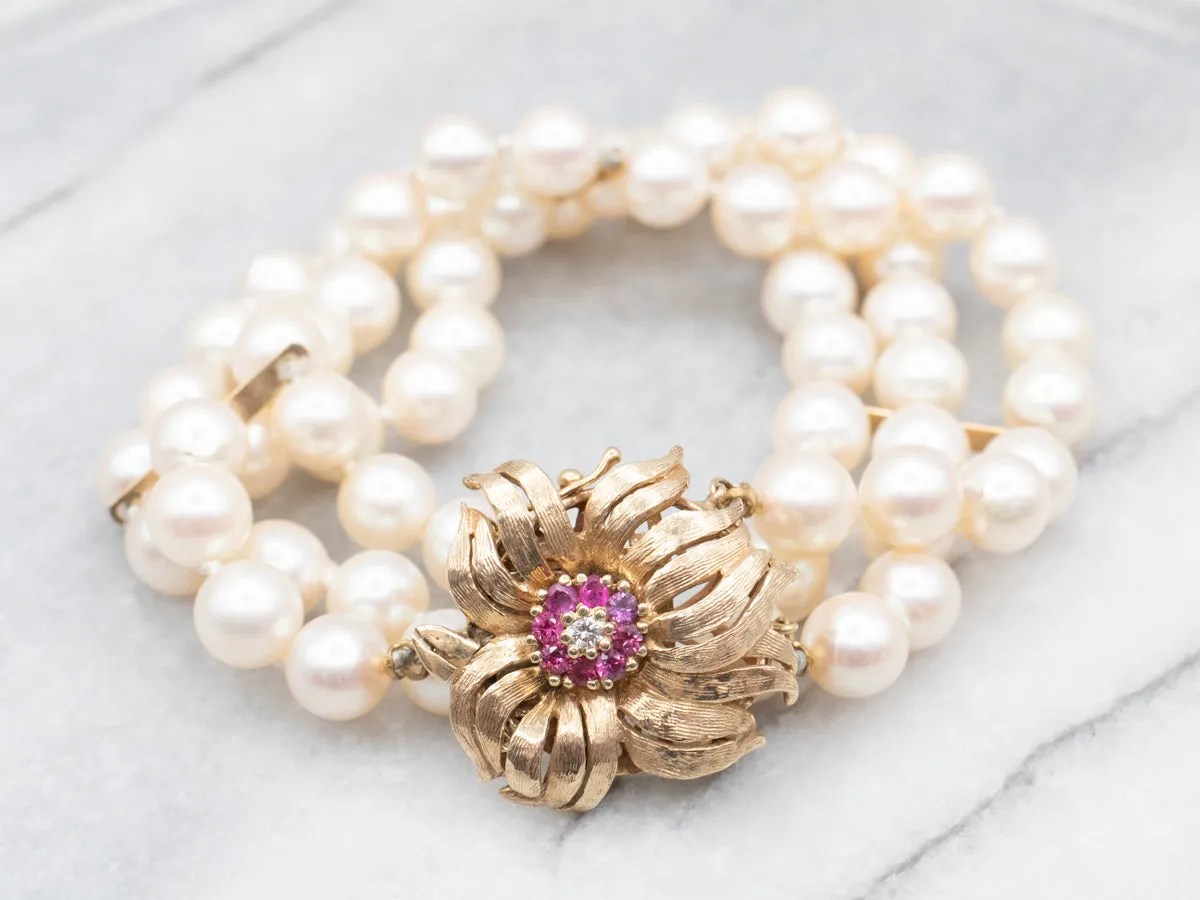 1960's Yellow Gold Ruby and Diamond Three Strand Pearl Bracelet with Flower Clasp