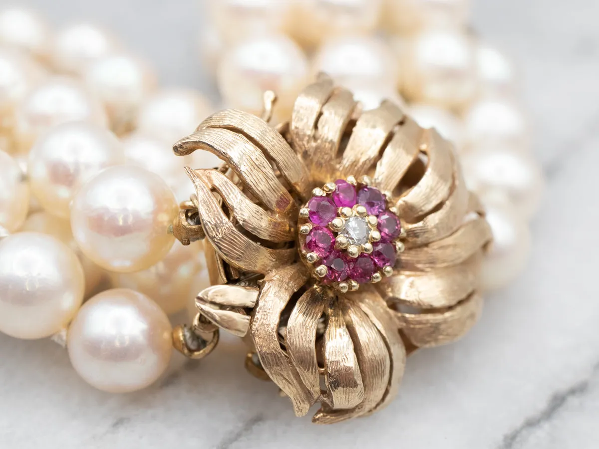 1960's Yellow Gold Ruby and Diamond Three Strand Pearl Bracelet with Flower Clasp