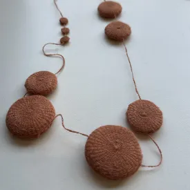 Flat disc hand crocheted necklace in apricot